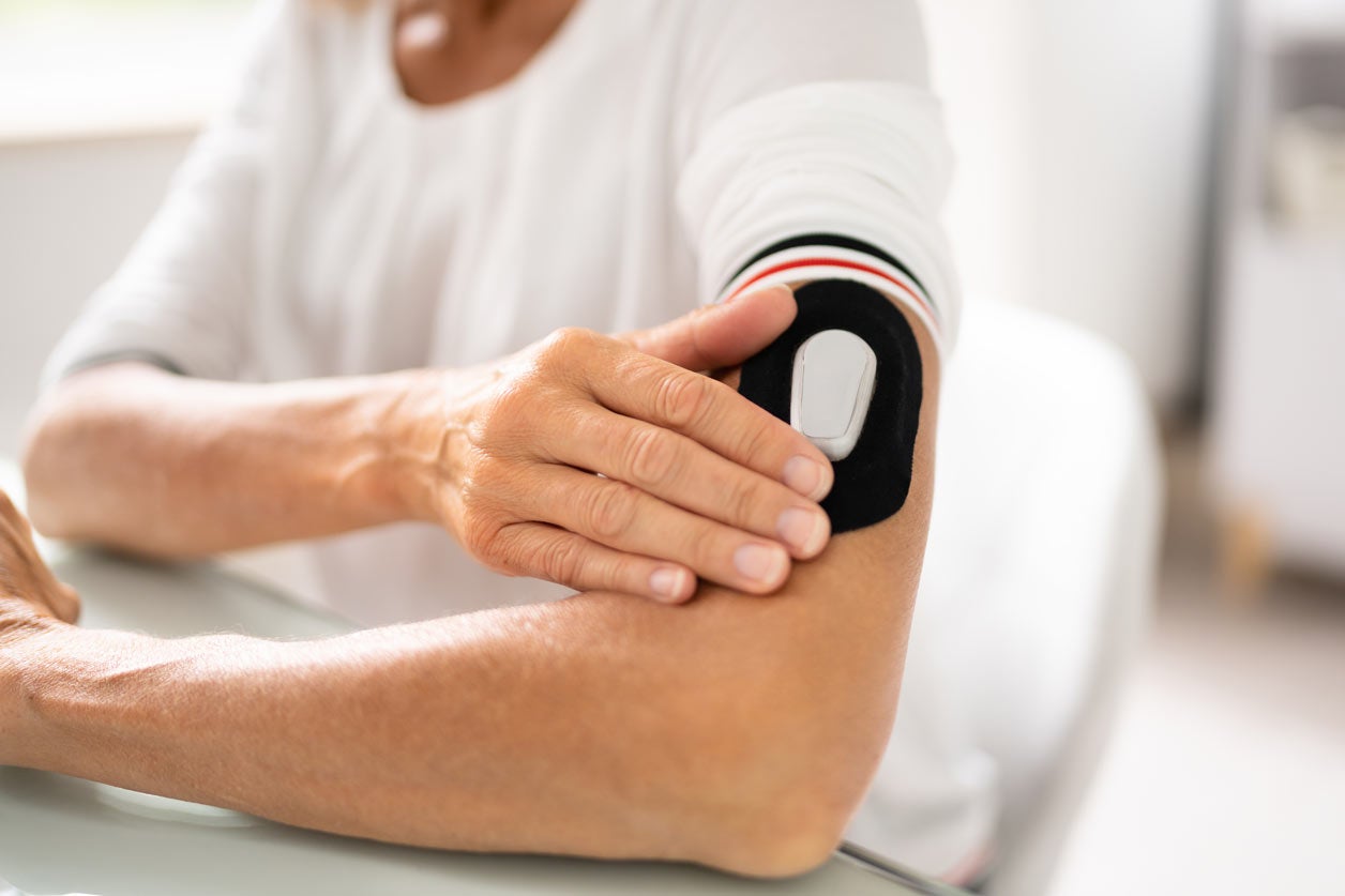 Woman checking her glucose levels